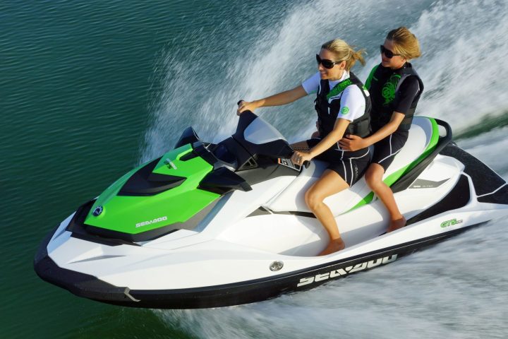 a person riding a surf board on a body of water